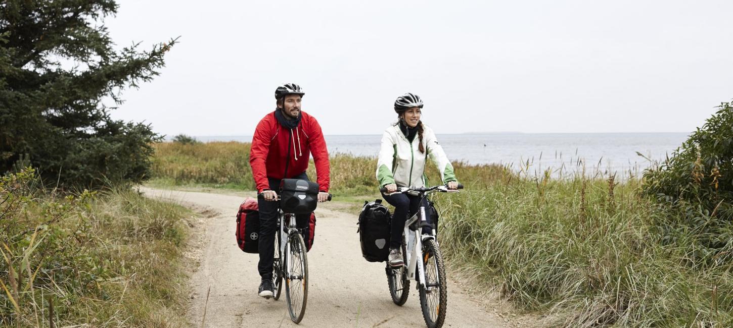 Couple cycling on the West coast cycling route (N1)