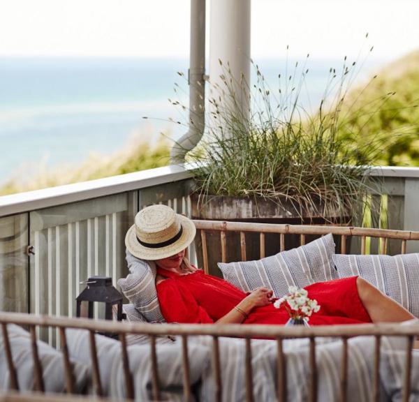 A woman relaxes at the luxury beach hotel Helenekilde Badehotel in North Zealand, Denmark