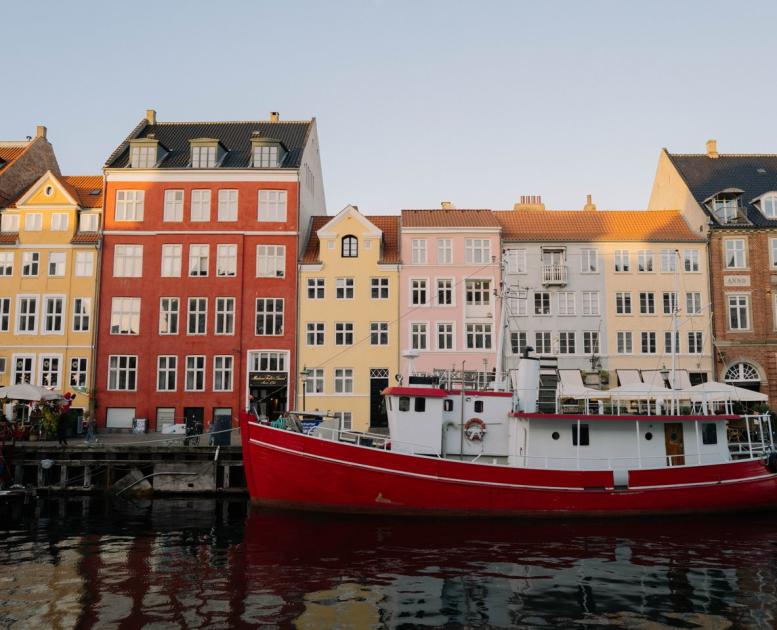 Boats and houses in Nyhavn in Copenhagen in autumn